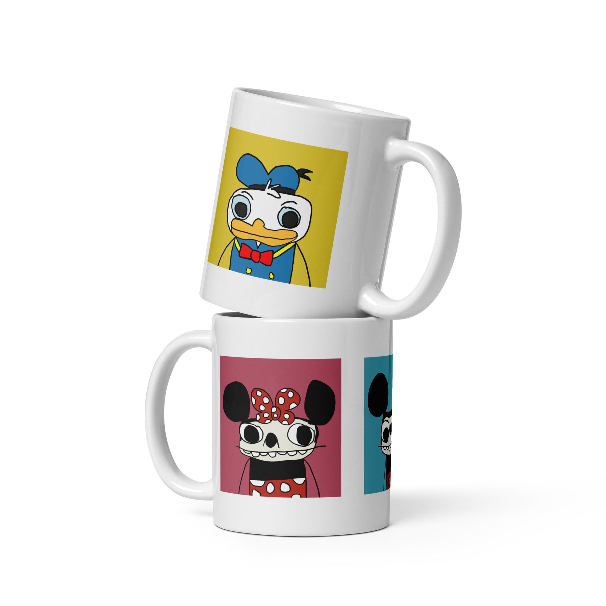 Two mugs stacked on top of each other with cartoon character designs on a white background